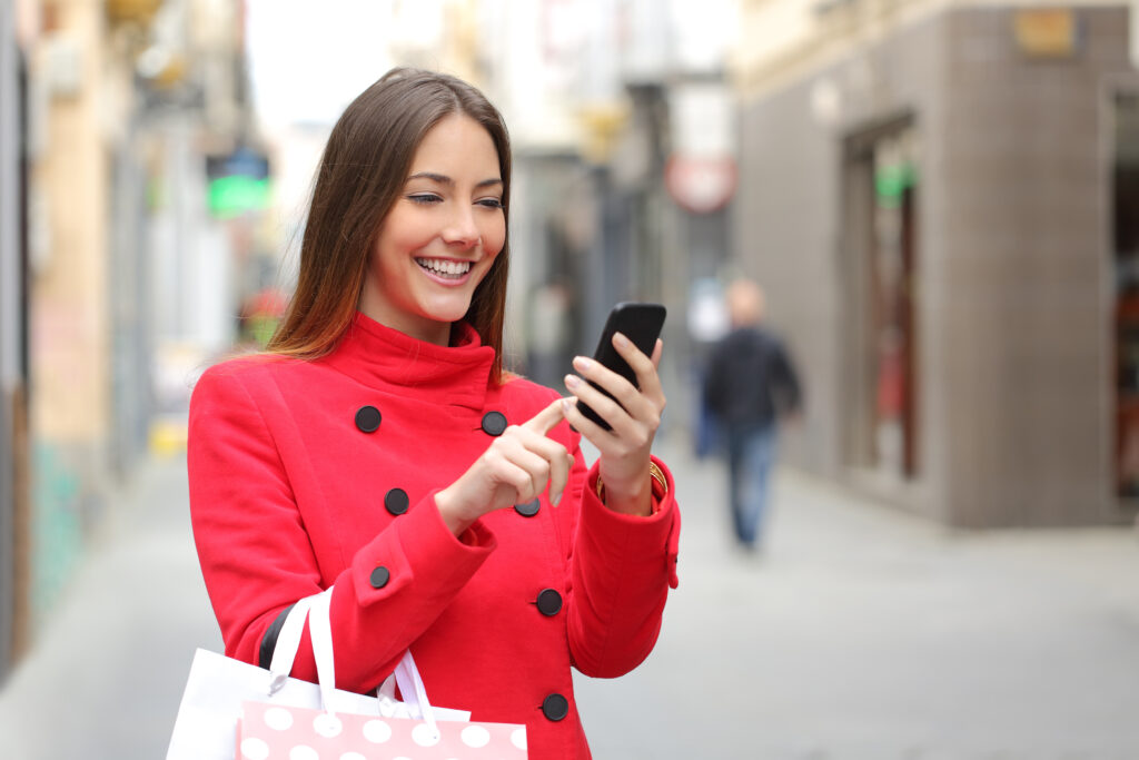 Shopper looking online on the smart phone for local restaurants and retail locations